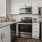 a kitchen with white cabinets