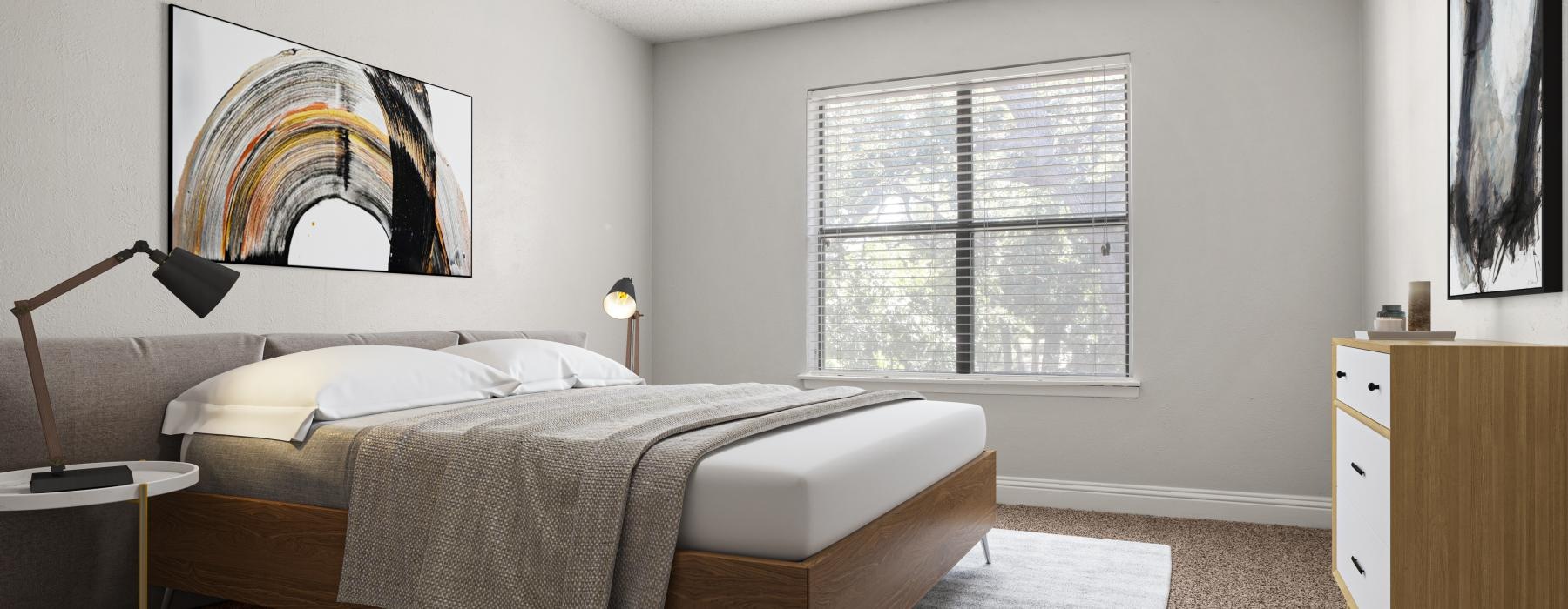 a bedroom with a bed, large window and lamps turned on